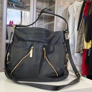 Black leather Michael Kors sack purse with shoulder & elbow strap